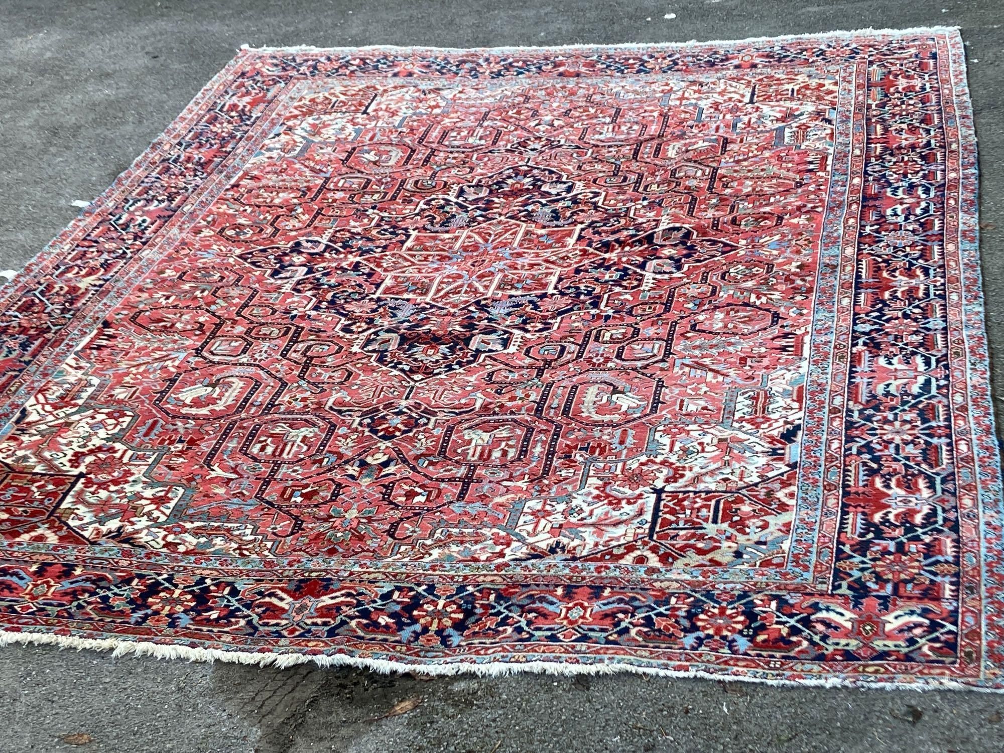 A large Persian red ground carpet, 444 x 347cm